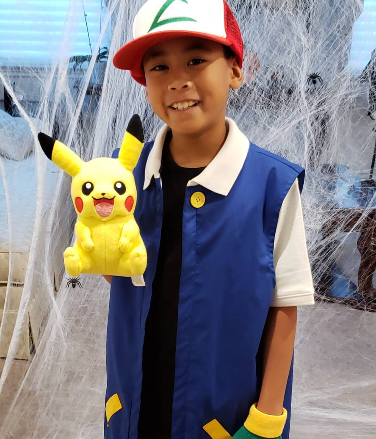 Aiden Nelson as a young child in a Pokémon costume